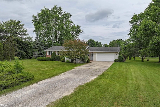 6494 W Coldwater Rd, Flushing, MI 48433 - view of front of house featuring concrete driveway, an attached garage, and a front yard