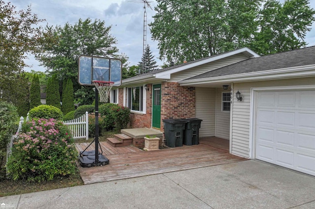 6494 W Coldwater Rd, Flushing, MI 48433 - view of side of home with brick siding, driveway, and a garage