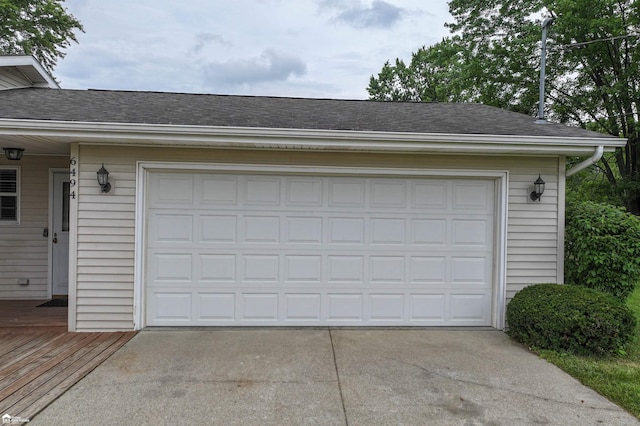 6494 W Coldwater Rd, Flushing, MI 48433 - garage featuring driveway