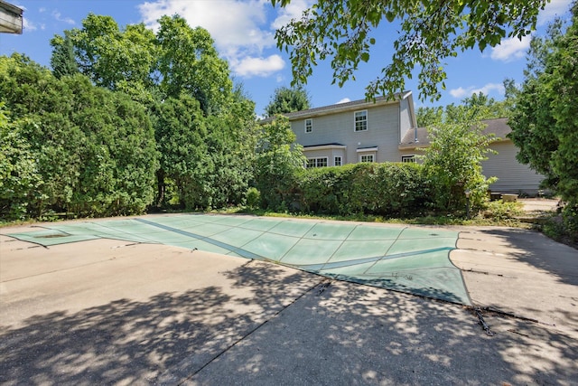 7987 36th St SE, Ada, MI 49301 - view of pool featuring a covered pool and a patio