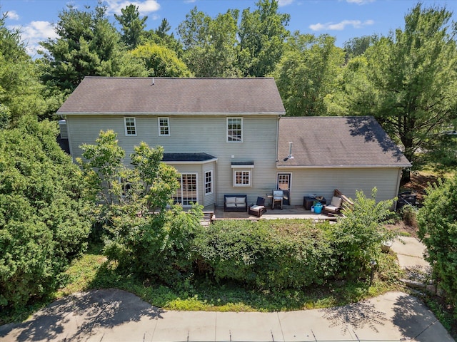 7987 36th St SE, Ada, MI 49301 - rear view of property featuring a patio area