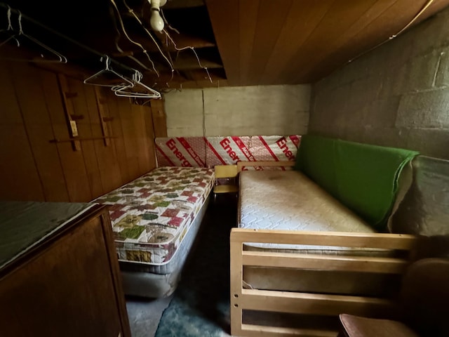4231 W 5 Mile Rd, Irons, MI 49644 - bedroom featuring concrete flooring