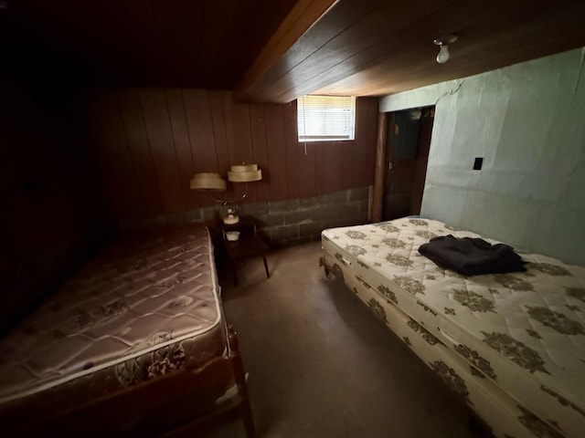 4231 W 5 Mile Rd, Irons, MI 49644 - carpeted bedroom featuring wooden walls and wooden ceiling