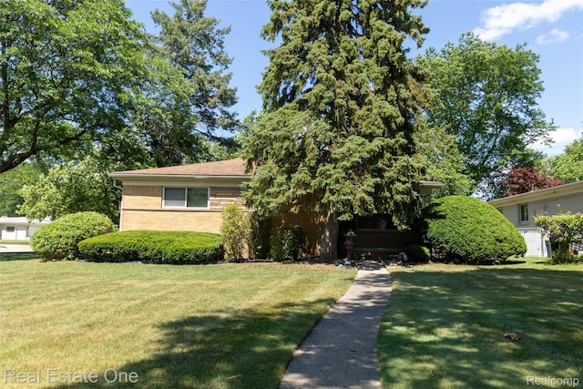 25640 Grand Concourse St, Southfield, MI 48075 - view of front facade with a front lawn and brick siding