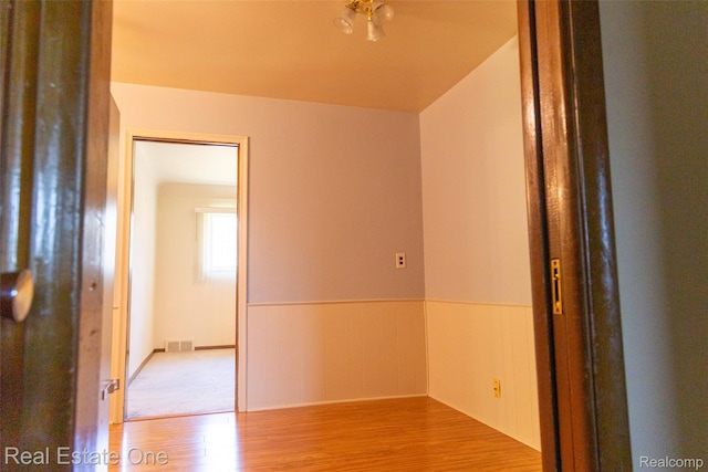 25640 Grand Concourse St, Southfield, MI 48075 - unfurnished room featuring wood finished floors and wainscoting