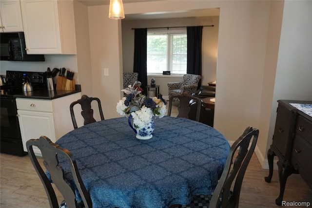 955 N Chevrolet Ave, Flint, MI 48504 - dining space featuring light wood-style flooring