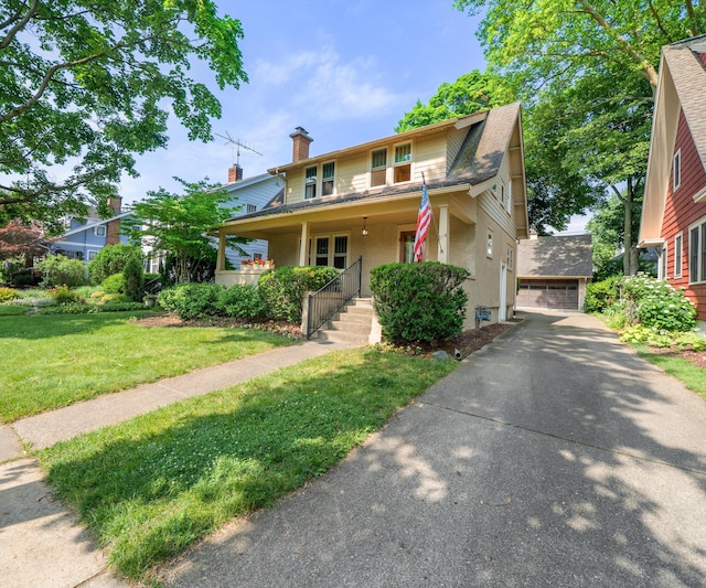 216 Kenwood Ave, Ann Arbor, MI 48103 - view of front of house featuring covered porch, a front lawn, a detached garage, stucco siding, and a chimney