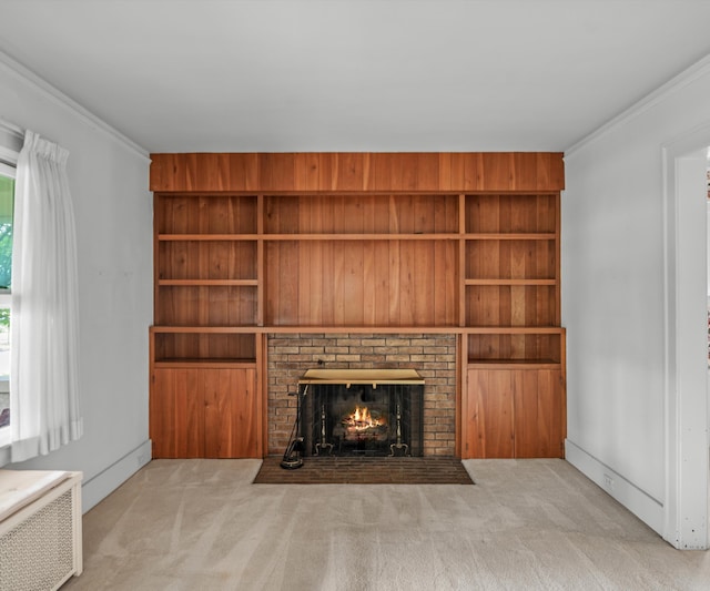 216 Kenwood Ave, Ann Arbor, MI 48103 - unfurnished living room featuring radiator, carpet flooring, a fireplace, and ornamental molding