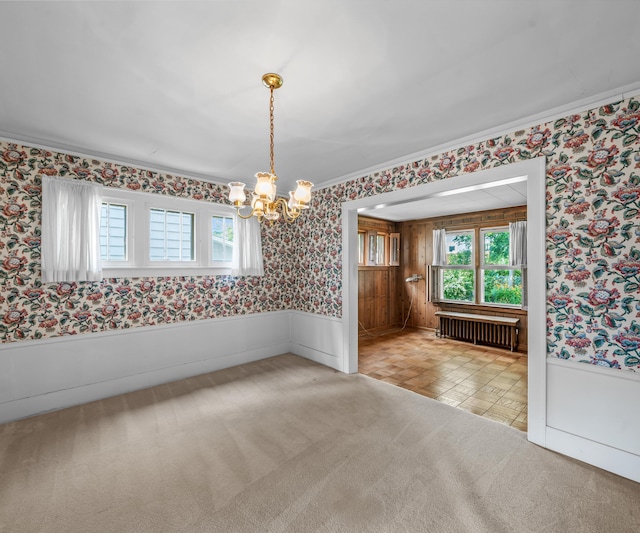 216 Kenwood Ave, Ann Arbor, MI 48103 - empty room with wallpapered walls, radiator heating unit, a chandelier, a wainscoted wall, and crown molding