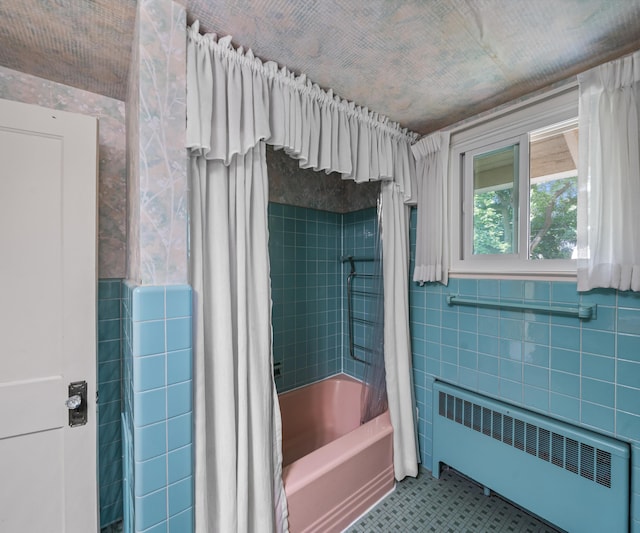 216 Kenwood Ave, Ann Arbor, MI 48103 - full bathroom with radiator heating unit, shower / bath combo, tile walls, and tile patterned flooring