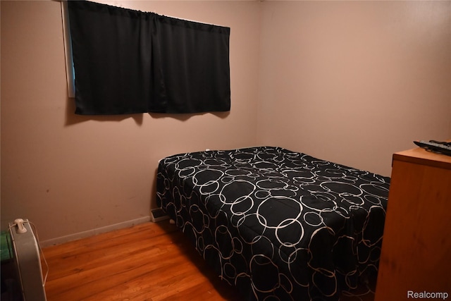 45225 Bemis Rd, Belleville, MI 48111 - bedroom featuring wood finished floors and baseboards