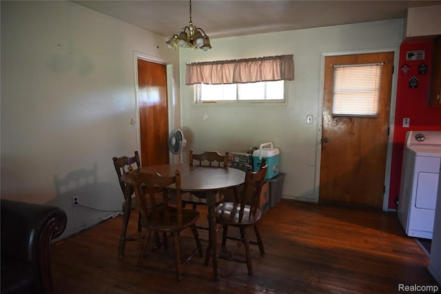 45225 Bemis Rd, Belleville, MI 48111 - dining room featuring washer / dryer, a chandelier, and wood finished floors