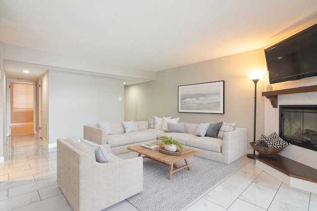 1740 Grove Rd Unit 106, Ypsilanti, MI 48198 - living room featuring light marble finish flooring, a glass covered fireplace, and recessed lighting