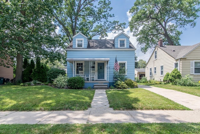 407 Flowerdale St, Ferndale, MI 48220 - cape cod home with a porch and a front lawn