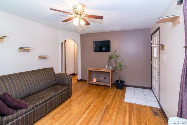 407 Flowerdale St, Ferndale, MI 48220 - living area featuring light wood-style floors, a ceiling fan, and arched walkways