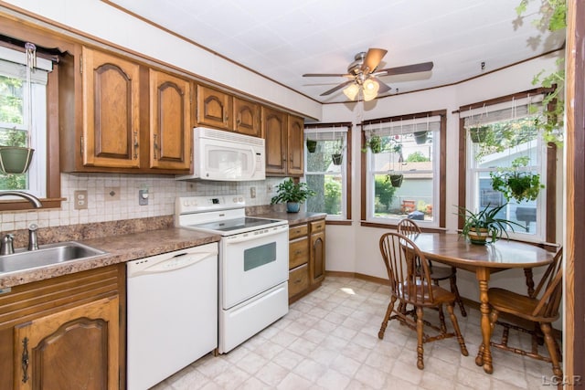407 Flowerdale St, Ferndale, MI 48220 - kitchen with white appliances, brown cabinetry, and healthy amount of natural light