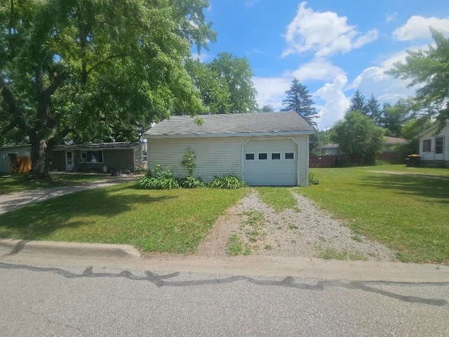 1308 W Broadway, Mount Pleasant, MI 48858 - view of front of home with driveway, a front yard, and a garage