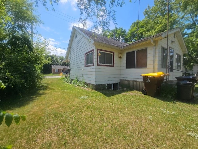 1308 W Broadway, Mount Pleasant, MI 48858 - view of property exterior featuring a yard