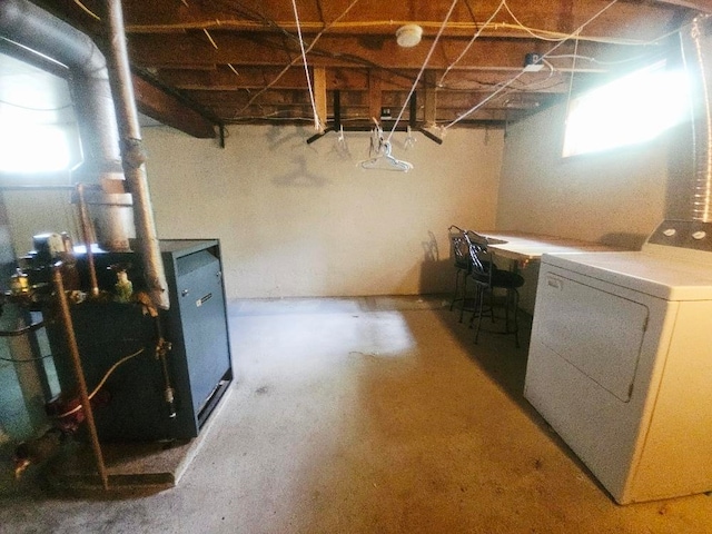 1308 W Broadway, Mount Pleasant, MI 48858 - below grade area featuring washer / dryer and a heating unit