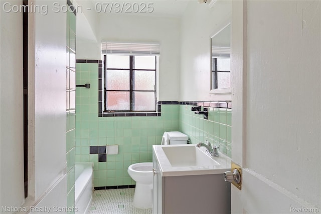 5981 University Pl, Detroit, MI 48224 - full bath with vanity, tile patterned floors, tile walls, wainscoting, and shower / tub combination