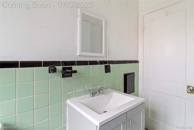 5981 University Pl, Detroit, MI 48224 - bathroom with vanity, tile walls, and a wainscoted wall