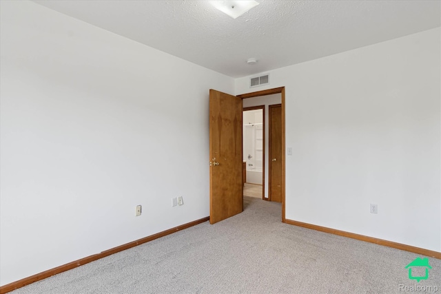 45833 Wildrye Ct, Van Buren, MI 48111 - unfurnished room featuring carpet flooring, a textured ceiling, and a smoke detector