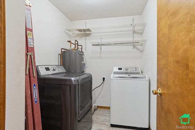 45833 Wildrye Ct, Van Buren, MI 48111 - laundry room featuring washer and dryer, water heater, and wood finished floors