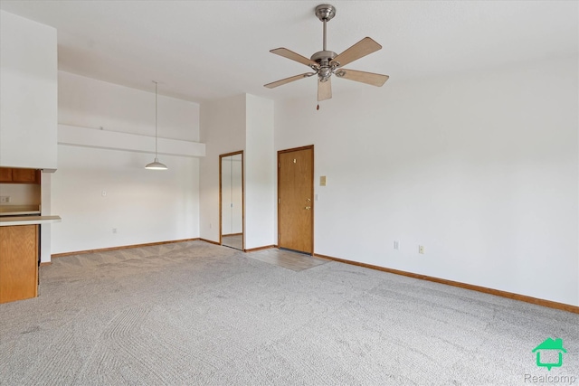 45833 Wildrye Ct, Van Buren, MI 48111 - unfurnished living room featuring carpet flooring, a ceiling fan, and high vaulted ceiling