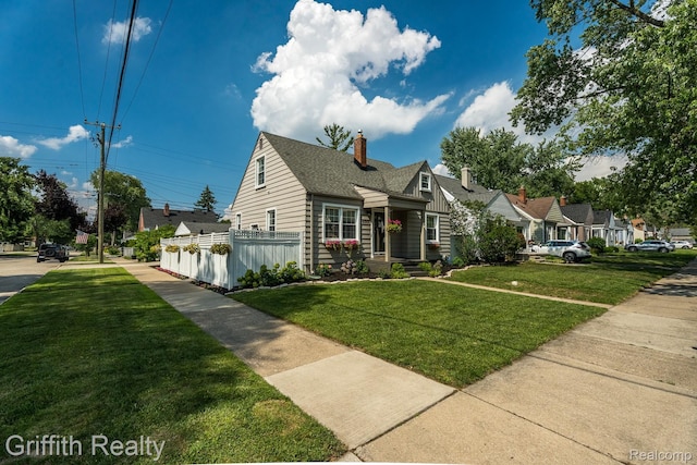 2001 Brockton Ave, Royal Oak, MI 48067 - view of front of house with a chimney, roof with shingles, and a residential view
