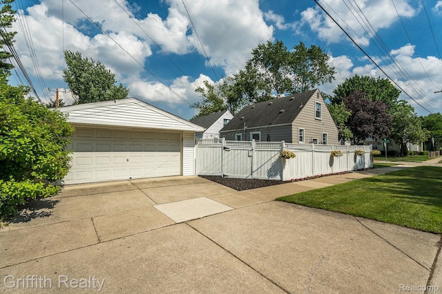 2001 Brockton Ave, Royal Oak, MI 48067 - view of side of home featuring a garage and an outbuilding