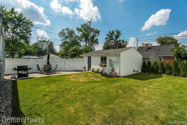 2001 Brockton Ave, Royal Oak, MI 48067 - fenced backyard featuring a gate, a patio area, and an outbuilding