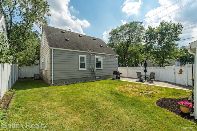 2001 Brockton Ave, Royal Oak, MI 48067 - back of property featuring roof with shingles, a fenced backyard, and a patio area