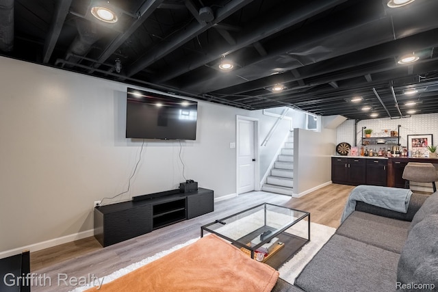 2001 Brockton Ave, Royal Oak, MI 48067 - living room with a bar, light wood finished floors, and stairway