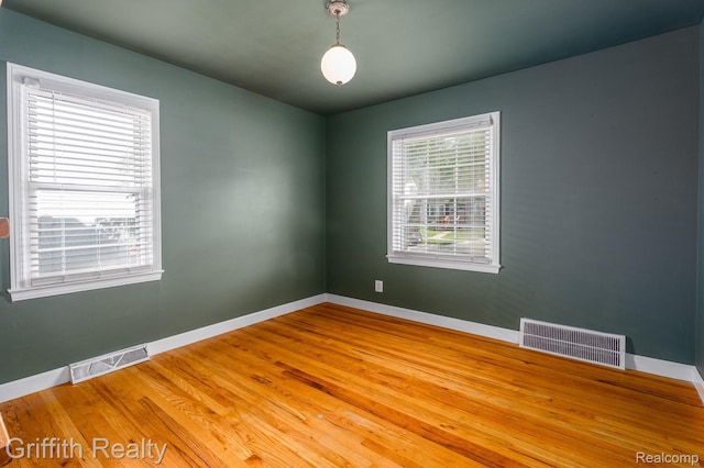 2001 Brockton Ave, Royal Oak, MI 48067 - unfurnished room featuring baseboards and wood finished floors