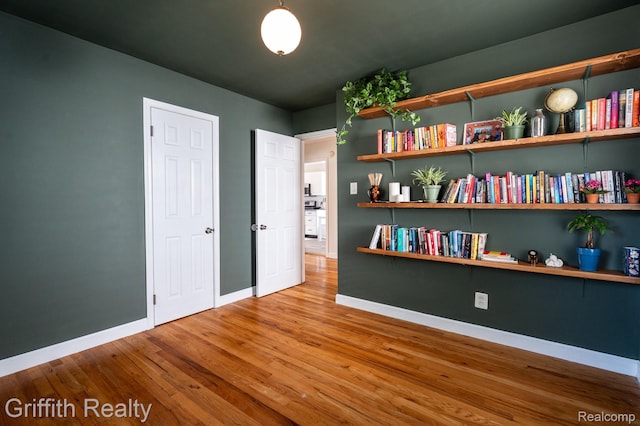 2001 Brockton Ave, Royal Oak, MI 48067 - unfurnished bedroom featuring wood finished floors and baseboards