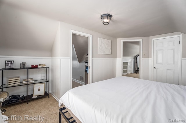 2001 Brockton Ave, Royal Oak, MI 48067 - bedroom with wainscoting, vaulted ceiling, and light colored carpet