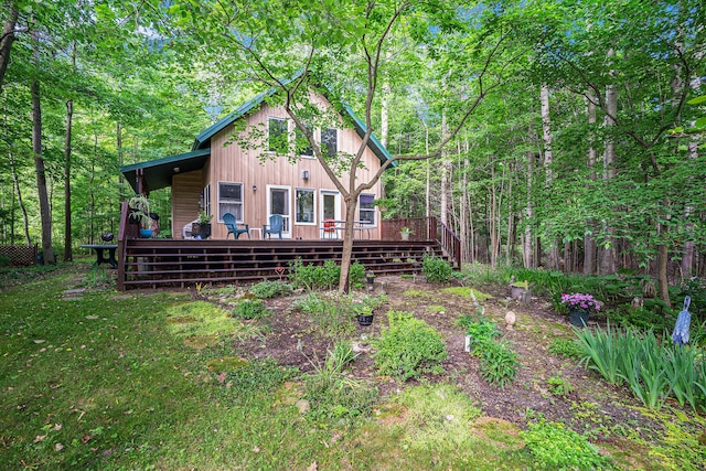 9191 W Ranger Rd, Mears, MI 49436 - back of house featuring a wooden deck and a forest view