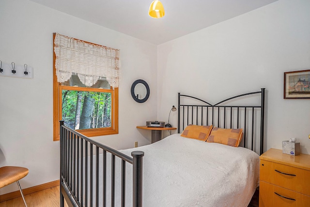 9191 W Ranger Rd, Mears, MI 49436 - bedroom featuring wood finished floors and baseboards