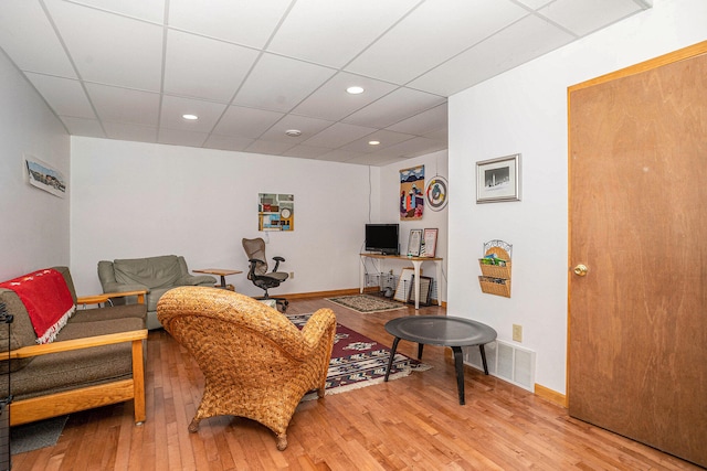 9191 W Ranger Rd, Mears, MI 49436 - living area with light wood-style floors, a paneled ceiling, and recessed lighting