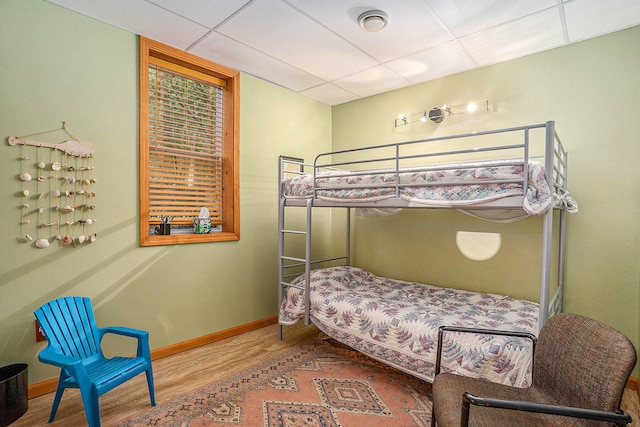 9191 W Ranger Rd, Mears, MI 49436 - bedroom with a drop ceiling and wood finished floors