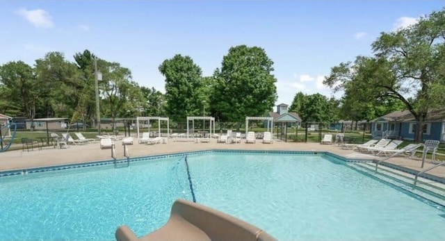 9191 W Ranger Rd, Mears, MI 49436 - community pool featuring a patio area