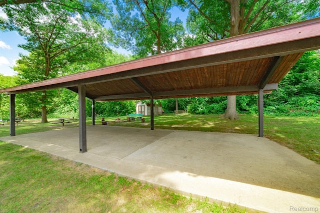 6674 Balmoral Ter, Clarkston, MI 48346 - view of community featuring a shed, a lawn, and a patio area