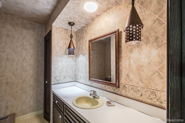6674 Balmoral Ter, Clarkston, MI 48346 - bathroom with vanity and tile patterned flooring