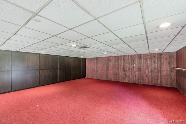 6674 Balmoral Ter, Clarkston, MI 48346 - empty room with carpet flooring, wood walls, a drop ceiling, and recessed lighting