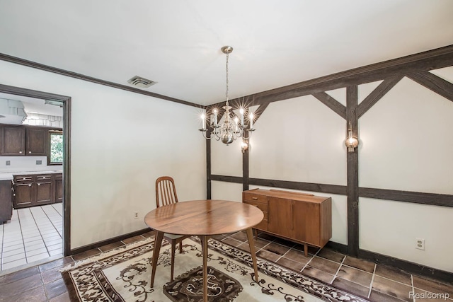 6674 Balmoral Ter, Clarkston, MI 48346 - dining space featuring a chandelier and baseboards