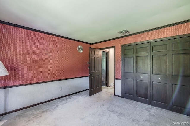 6674 Balmoral Ter, Clarkston, MI 48346 - unfurnished bedroom featuring a closet, light colored carpet, and ornamental molding