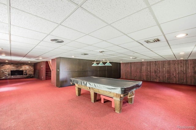 6674 Balmoral Ter, Clarkston, MI 48346 - rec room featuring carpet flooring, wooden walls, a paneled ceiling, billiards table, and a brick fireplace