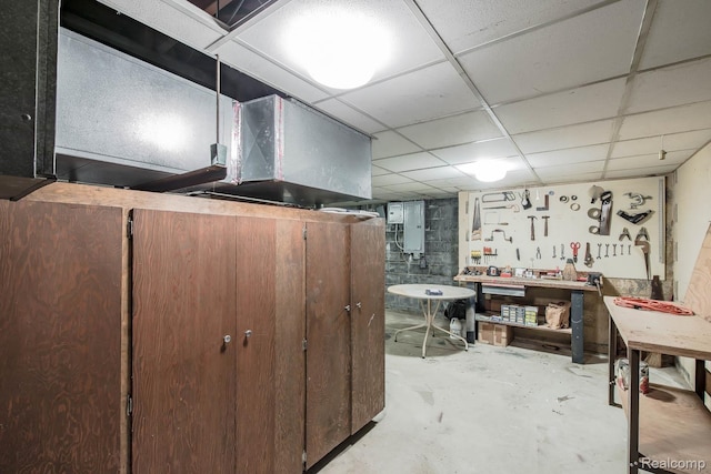6674 Balmoral Ter, Clarkston, MI 48346 - finished basement featuring a workshop area, a drop ceiling, and electric panel
