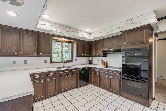 6674 Balmoral Ter, Clarkston, MI 48346 - kitchen with black appliances, under cabinet range hood, dark brown cabinetry, light countertops, and light tile patterned floors