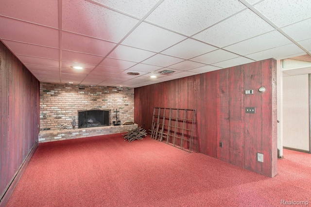 6674 Balmoral Ter, Clarkston, MI 48346 - basement with carpet floors, a brick fireplace, wooden walls, and a paneled ceiling